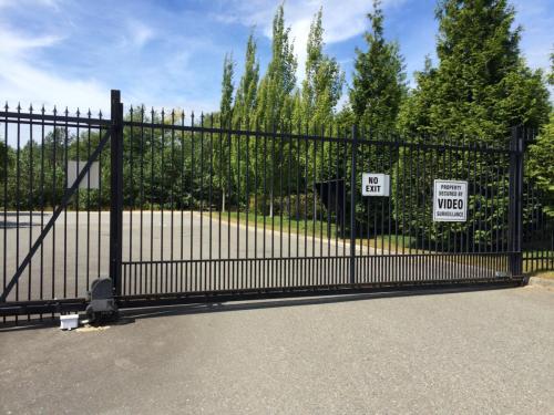 TG273 Cantilever sliding gate-bottom track with pickets in Surrey