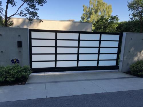 TG578 cantilever sliding gate aluminum frame with glass in-fill in west Vancouver